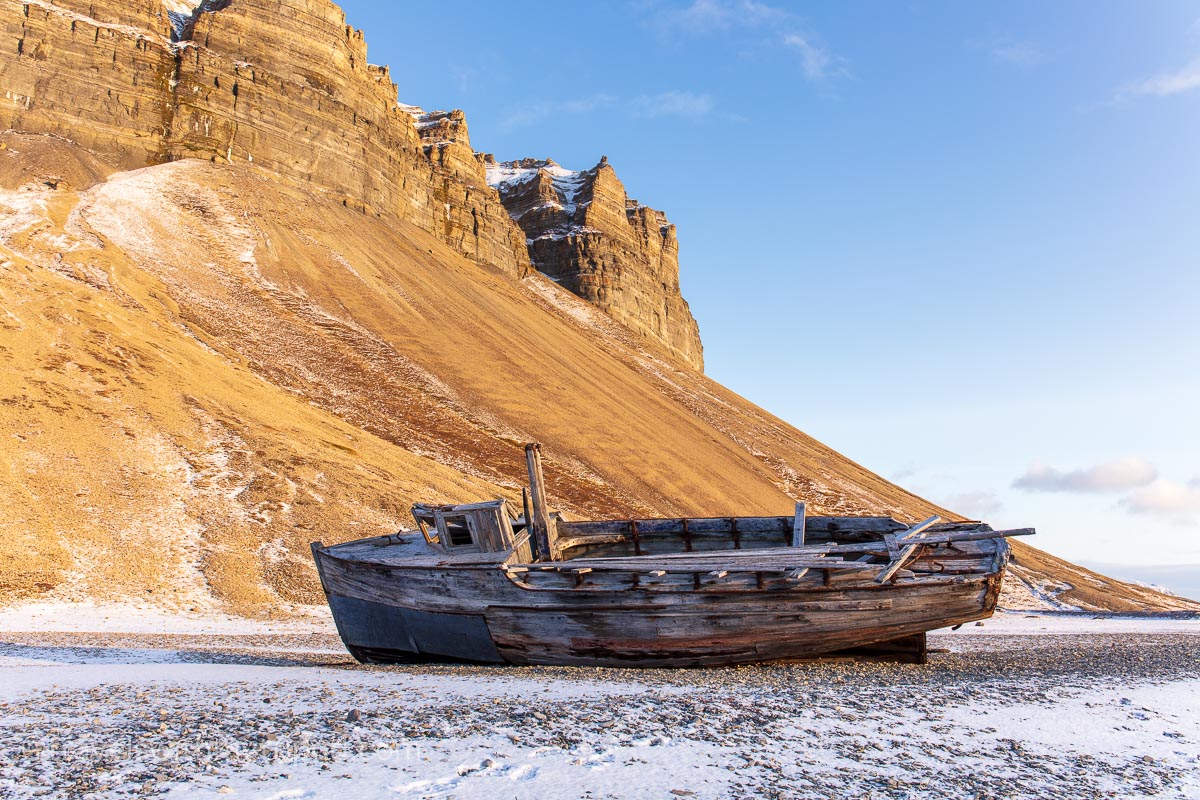 Wooden barge on shore at Skansbukta, Svalbard
