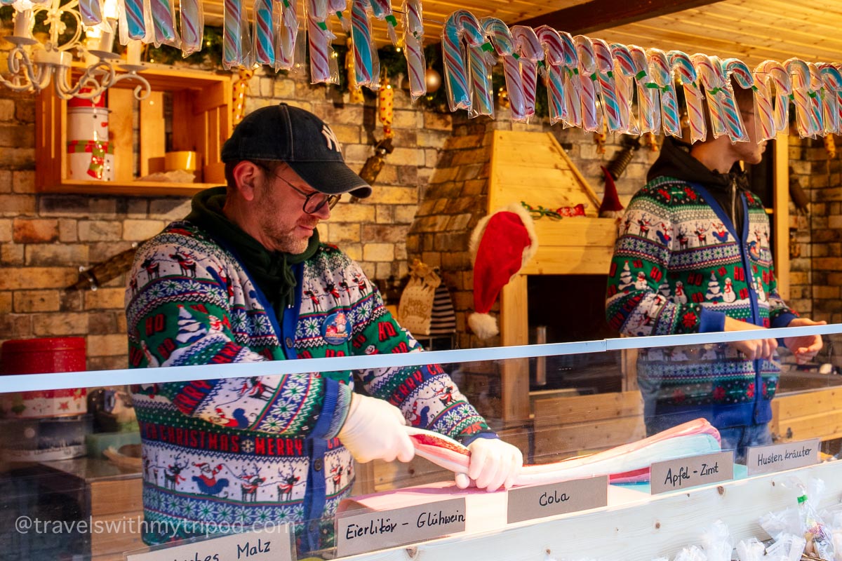 Candy cane being made by hand at a Cologne Christmas market
