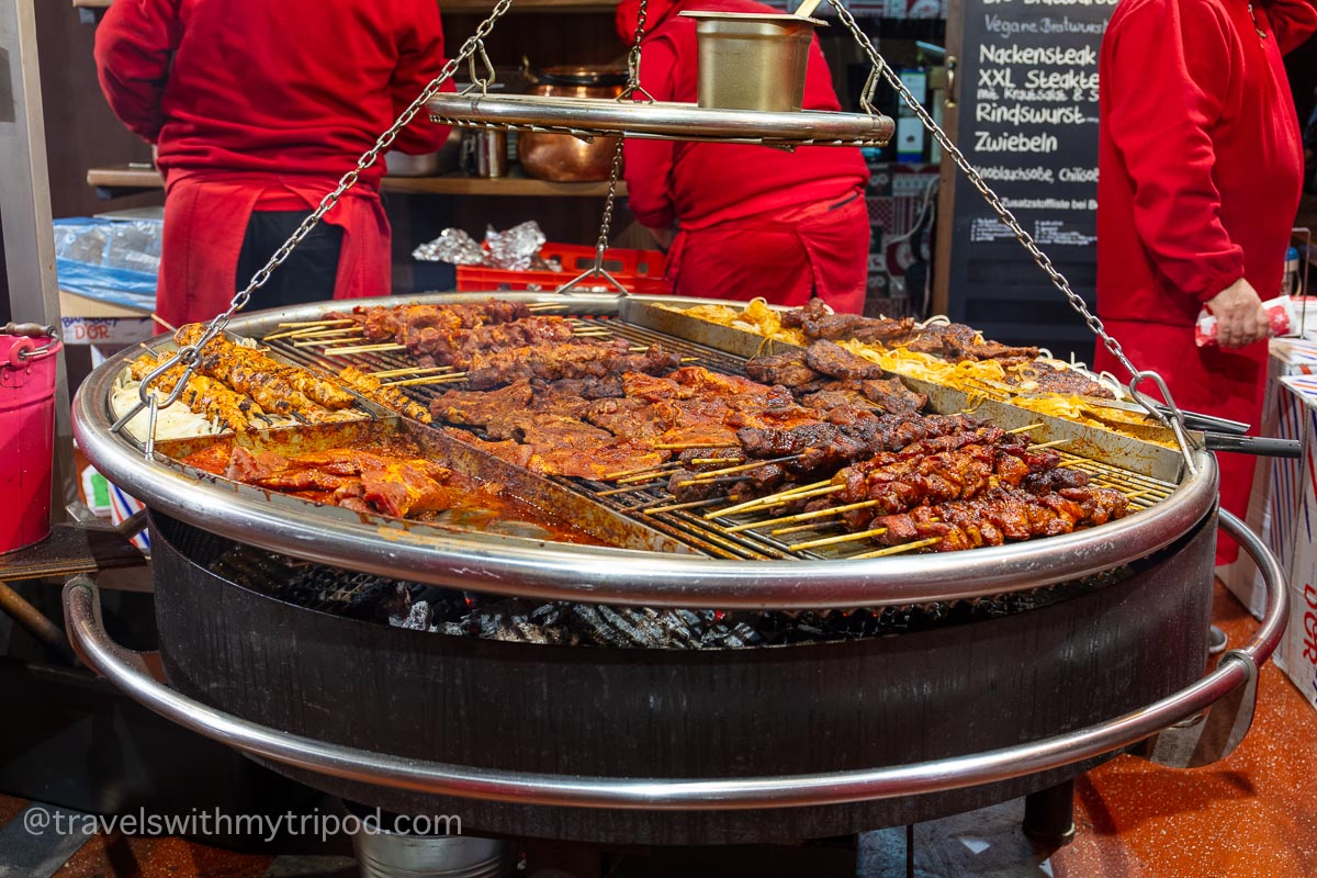 Grilled meat being cooked at a Christmas market in Cologne